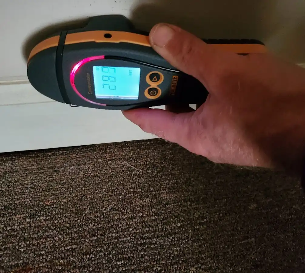 Moisture detection at baseboard during Storm Damage Restoration in Mansfield